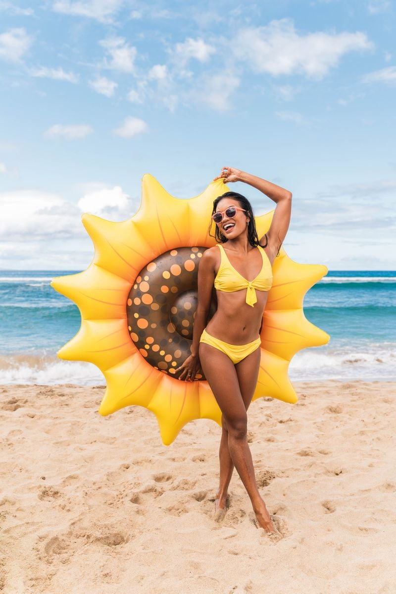 Get Ready for Summer Fun with PoolCandy's Inflatable Sunflower Island Pool Float - Perfect for Parties and Relaxation. The Ultimate Swimming Pool Inflatable Toy.