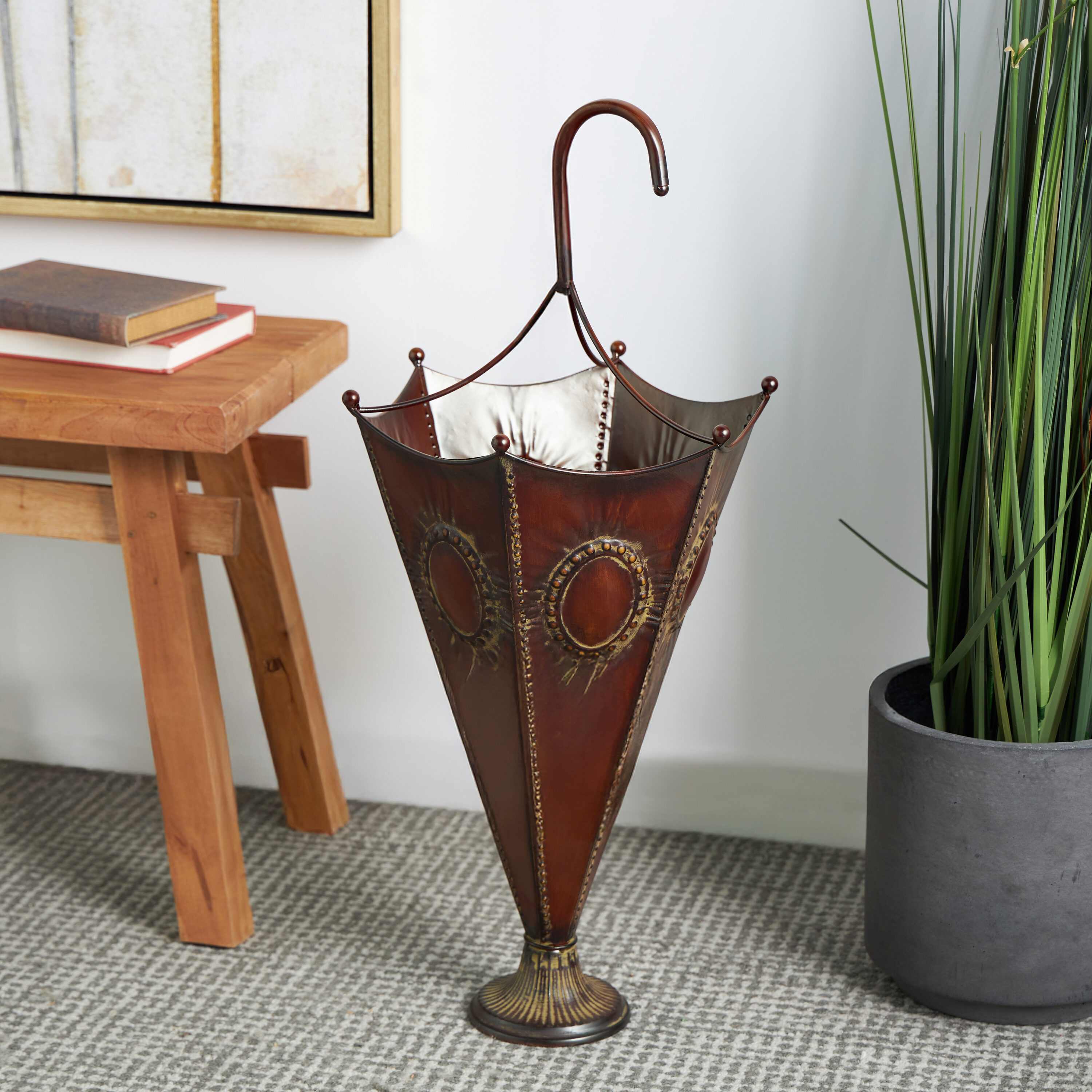 DecMode Brown Metal Umbrella Stand with Embossed Emblems