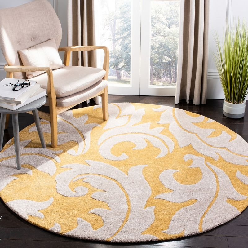 Soho SOH841 Hand Tufted Indoor Area Rug - Gold/Ivory - 6' round - Safavieh.
