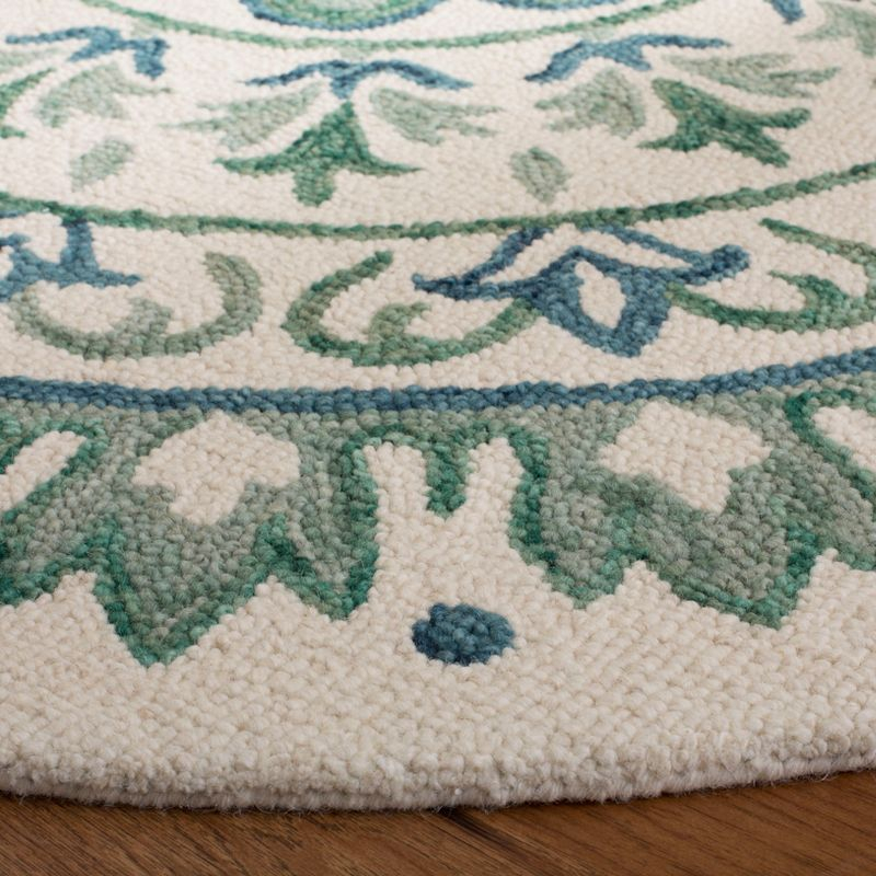 Novelty NOV607 Hand Tufted Area Rug - Ivory/Teal - 6' Round - Safavieh.