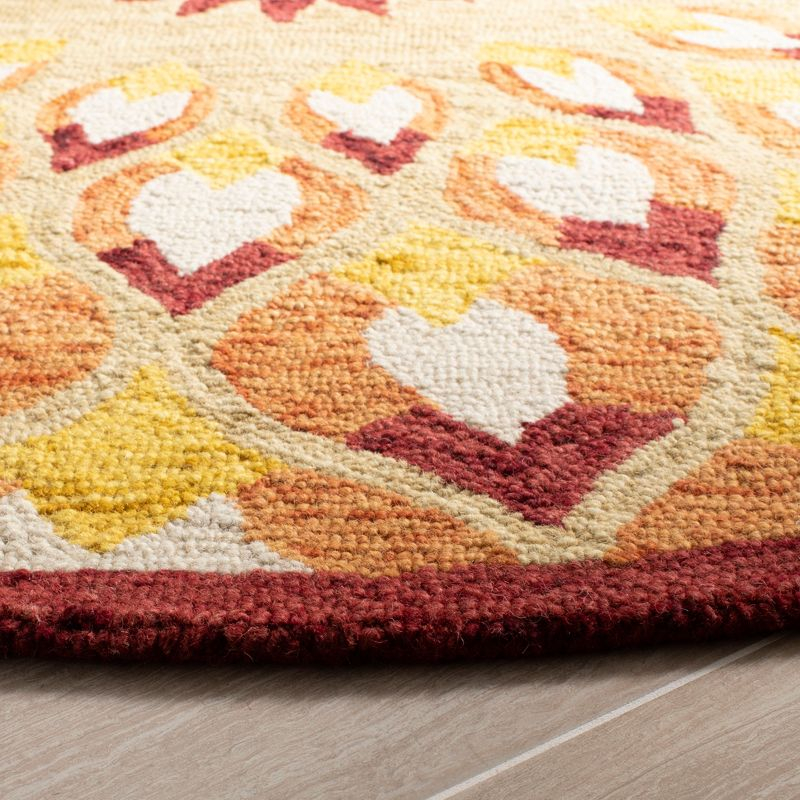 Novelty NOV603 Hand Tufted Area Rug - Rust/Gold - 3' round - Safavieh.