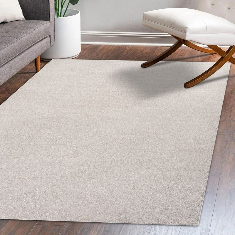 8'x10' Haze Solid Low-Pile Area Rug, Ivory - JONATHAN Y