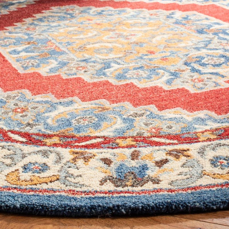 Antiquity AT505 Hand Tufted Area Rug - Blue/Red - 6' Round - Safavieh.