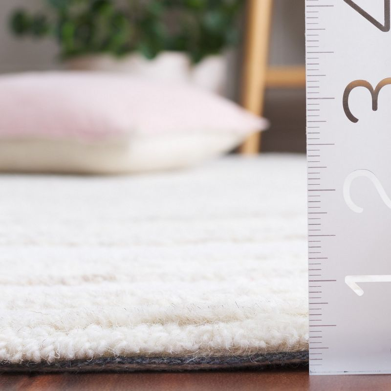 Ebony EBN551 Hand Tufted Area Rug - Ivory/Beige - 6'x9' - Safavieh.
