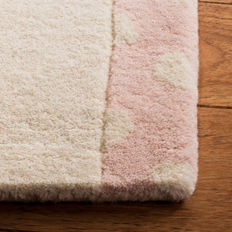 Safavieh Kids SFK922 Hand Tufted Area Rug - Pink/Ivory - 8'x10' - Safavieh.