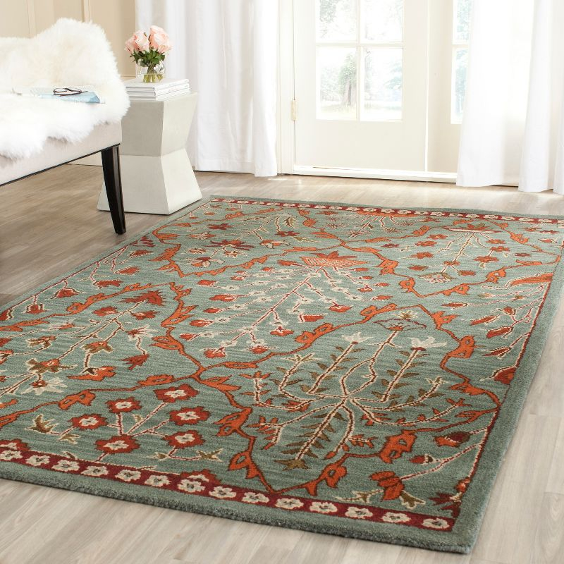 Wyndham WYD206 Hand Tufted Area Rug - Blue/Rust - 5'x8' - Safavieh.