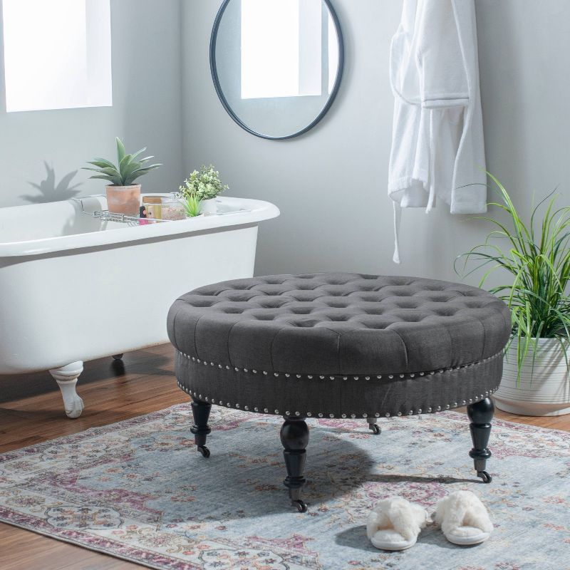 34.6" Isabelle Traditional Round Tufted Upholstered Wheeled Cocktail Ottoman Gray - Linon: Charcoal Linen, Silver Nailhead, Black Legs
