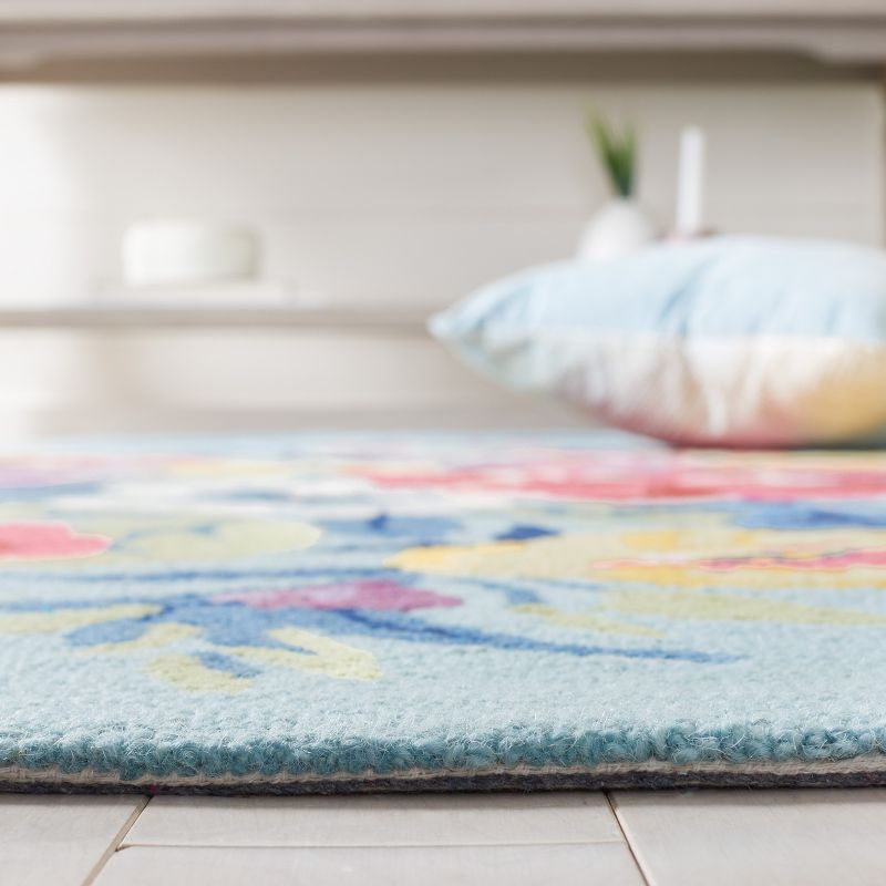 Chelsea HK219 Hand Tufted Area Rug - Blue/Rose - 6'x9' Oval - Safavieh.