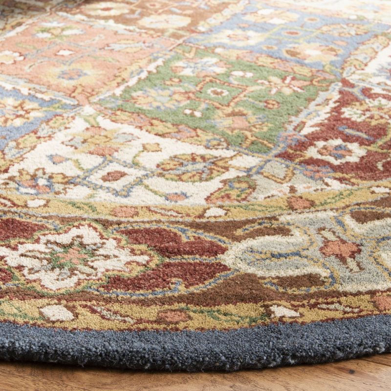 Heritage HG316 Handmade Area Rug - 4'6"x6'6" Oval - Green/Red - Safavieh