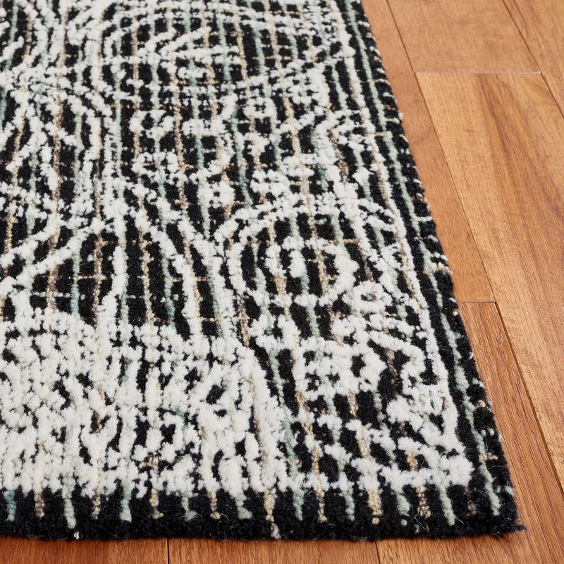 Ebony EBN114 Hand Tufted Area Rug - Black/Ivory - 6'x9' - Safavieh.