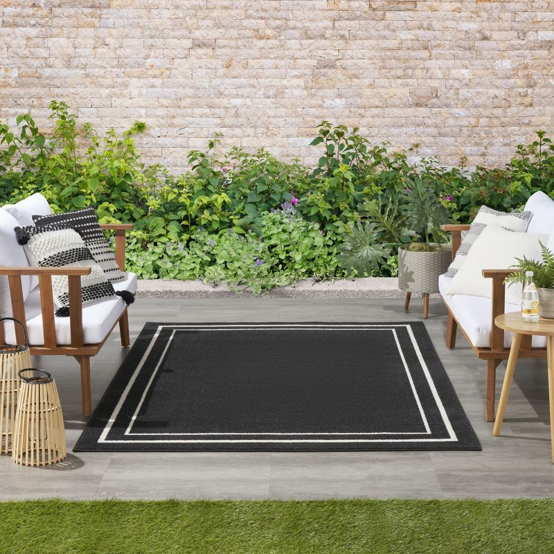 Nourison Essentials 4' x 6' Black Ivory Contemporary Bordered Indoor/Outdoor Area Rug