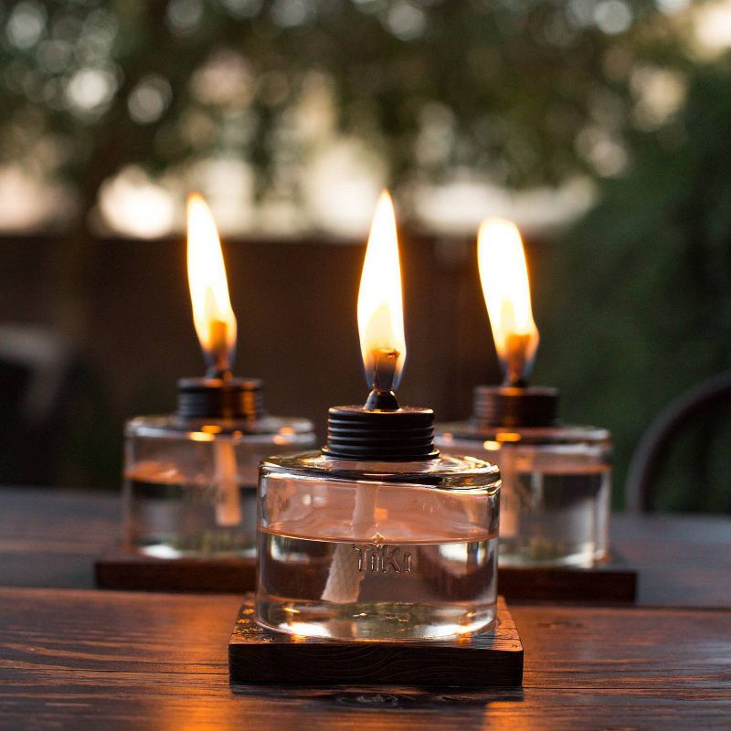 TIKI Mixed Material Tabletop Torch: Weather-Resistant, Smooth Finish, Refillable Fuel Canister, No Assembly Required