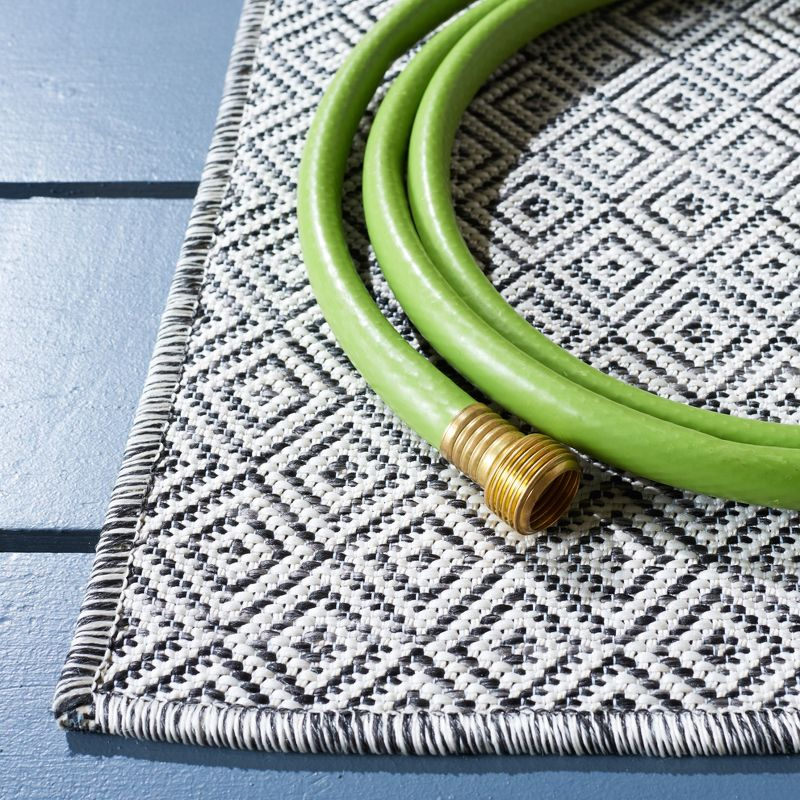 Hampton HTN230 Power Loomed Indoor/Outdoor Area Rug - Ivory/Black - 8'x10' - Safavieh.