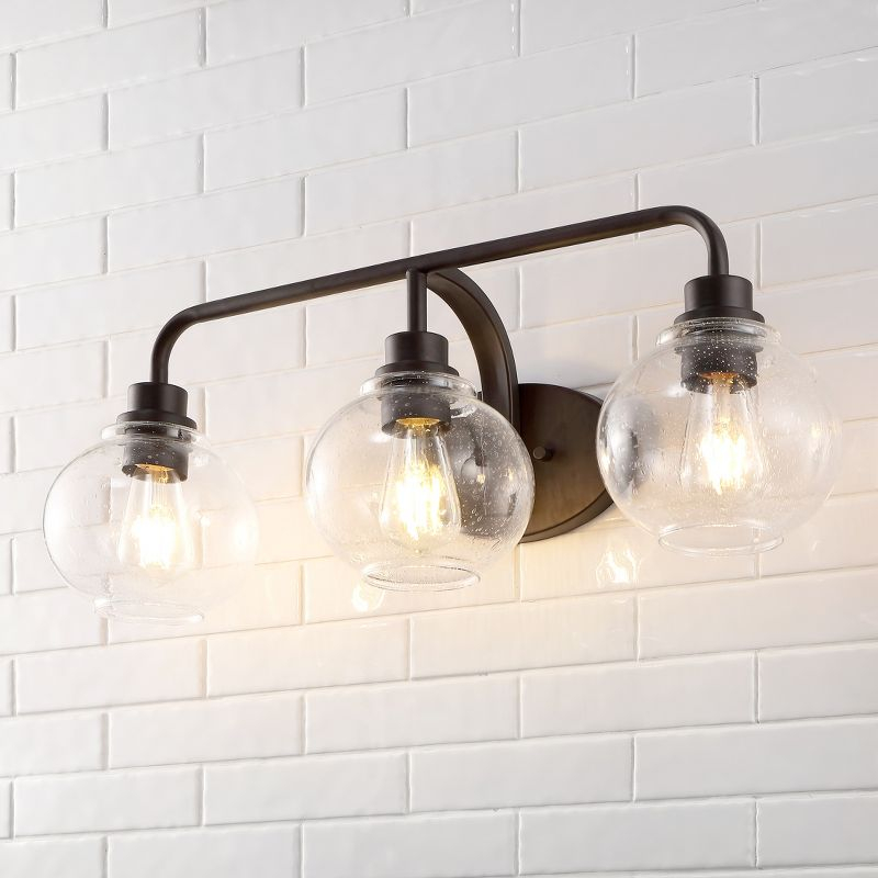 JONATHAN Y Sandrine 26.25" 3-Light Iron/Seeded Glass Cottage Rustic LED Vanity Light, Oil Rubbed Bronze