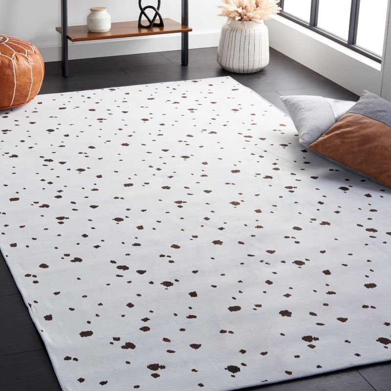 Faux Hide FAH502 Power Loomed Machine Washable Area Rug - Ivory/Black - 6'x9' - Safavieh.