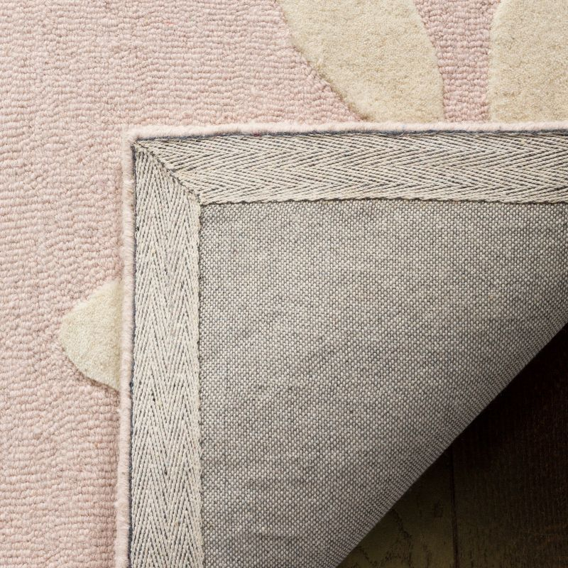 Safavieh Kids SFK914 Hand Tufted Area Rug - Pink/Ivory - 5'x5' - Safavieh.