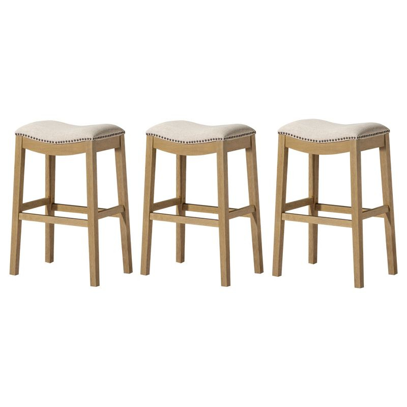 Maven Lane Adrien 26 Inch Counter Height Upholstered Backless Saddle Barstool in Natural Wood Finish with Wheat Cream Fabric Cushion Seat, Set of 3