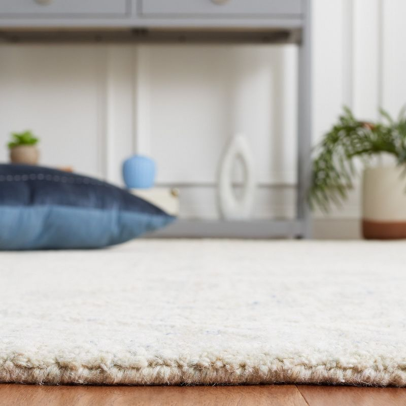 Ebony EBN111 Hand Tufted Area Rug - Blue/Ivory - 5'x8' - Safavieh.