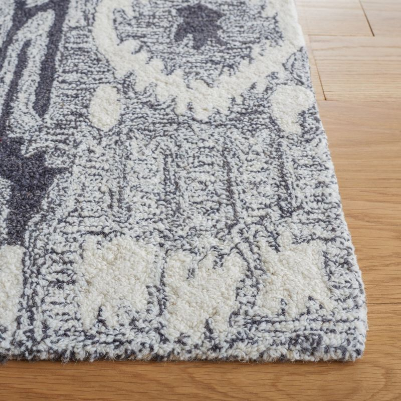 Ikat IKT653 Hand Tufted Area Rug - Ivory/Black - 5'x8' - Safavieh.