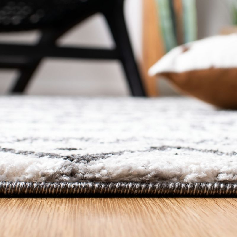 Tunisia TUN735 Power Loomed Area Rug - Ivory/Black - 8'x10' - Safavieh.