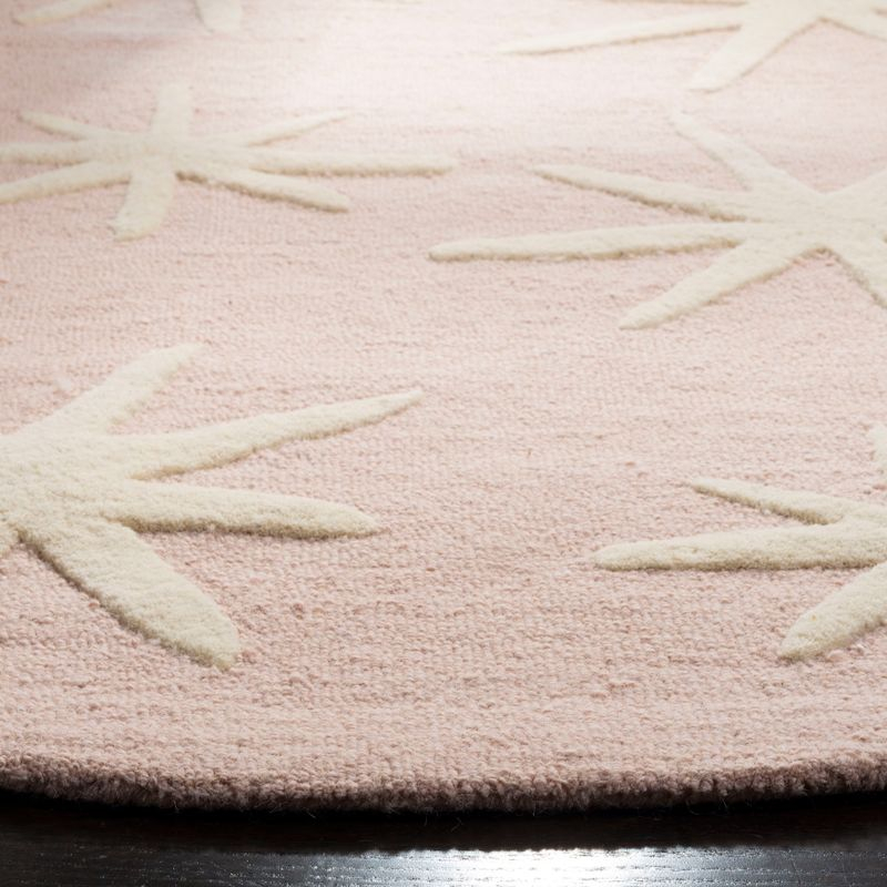 Safavieh Kids SFK908 Hand Tufted Area Rug - Pink/Ivory - 5' round - Safavieh.