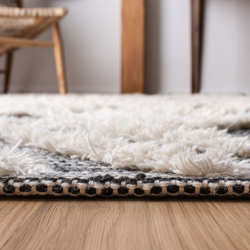 Kenya KNY331 Hand Tufted Area Rug - Black/Ivory - 5'x8' - Safavieh.