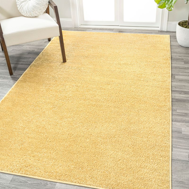 8'x10' Haze Solid Low-Pile Area Rug, Mustard - JONATHAN Y