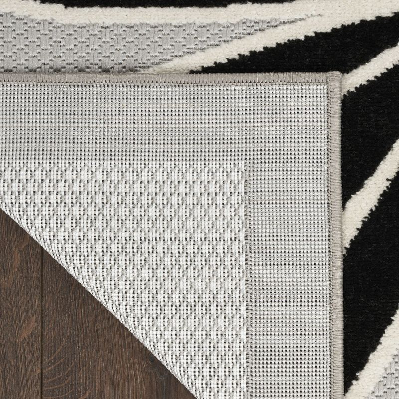 Nourison Aloha Daisy Flower Flatweave High-Low Indoor Outdoor Area Rug Black White 5'3" x 7'5"