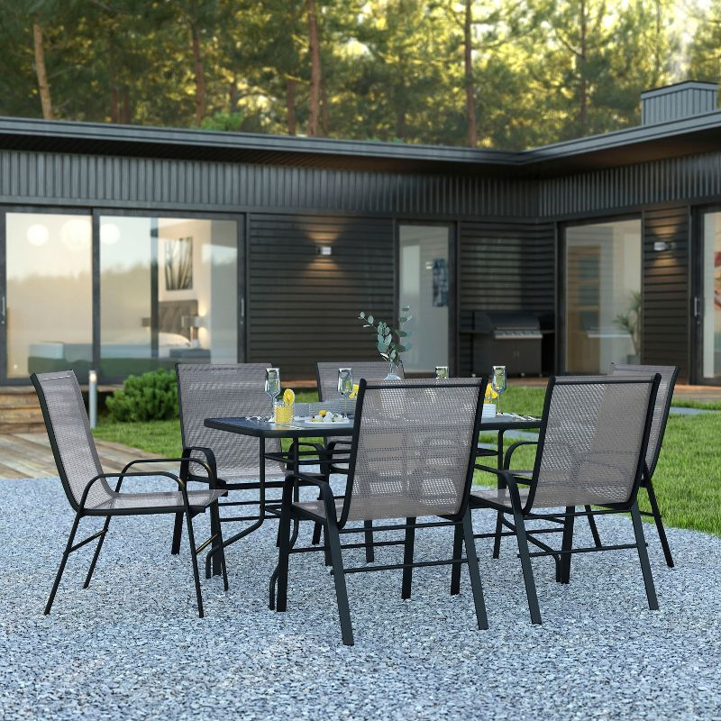 Flash Furniture 7 Piece Outdoor Patio Dining Set - 55" Tempered Glass Patio Table with Umbrella Hole, 6 Gray Flex Comfort Stack Chairs