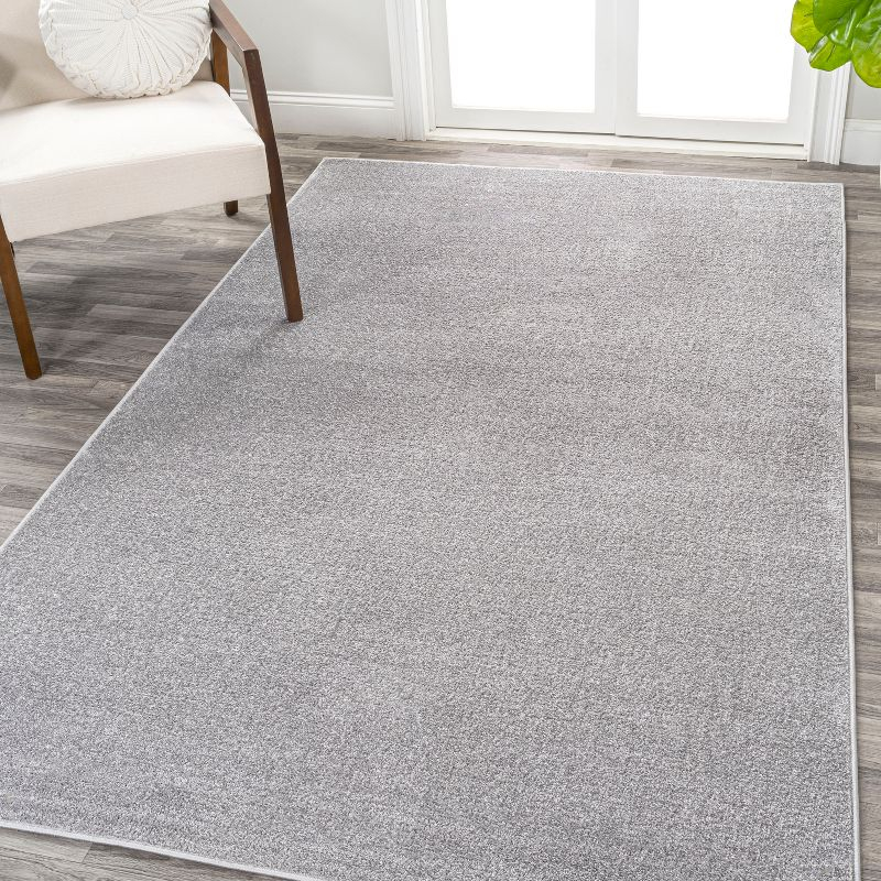 8'x10' Haze Solid Low-Pile Area Rug, Light Gray - JONATHAN Y