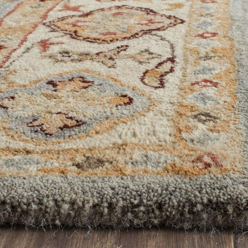 Antiquity AT847 Hand Tufted Area Rug - Blue/Ivory - 6'x9' - Safavieh.