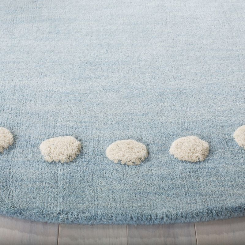 Safavieh Kids SFK802 Hand Loomed Indoor Area Rug - Blue/Ivory - 5' Round - Safavieh