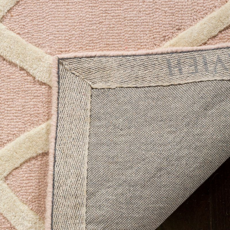 Safavieh Kids Abstract SFK905 Hand Tufted Indoor Accent Rug - Pink/Ivory - 4'x6' - Safavieh