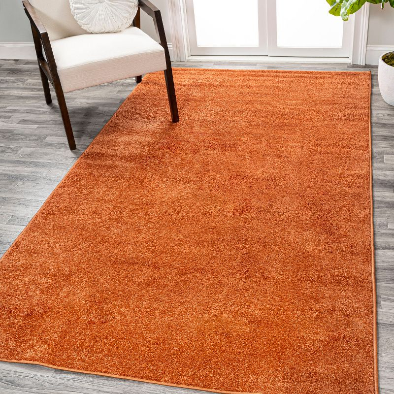 8'x10' Haze Solid Low-Pile Area Rug, Orange - JONATHAN Y