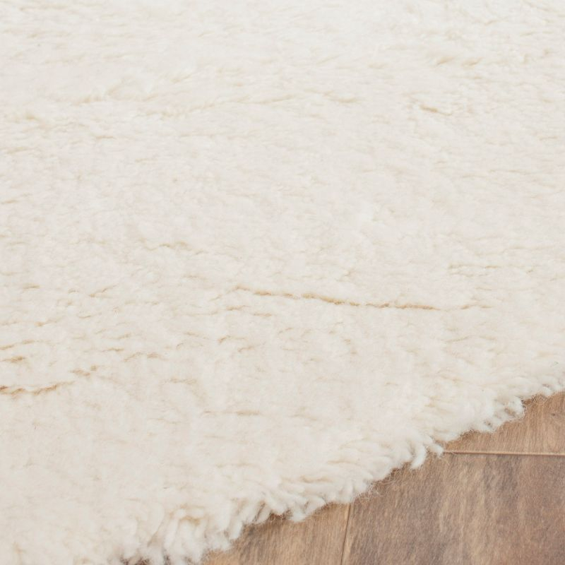 Flokati FLK150 Hand Tufted Round Area Rug - Ivory - 6' Round Safavieh.