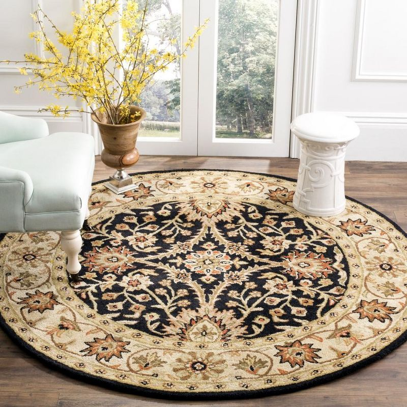 Antiquity AT249 Hand Tufted Area Rug - Black - 8' round - Safavieh.