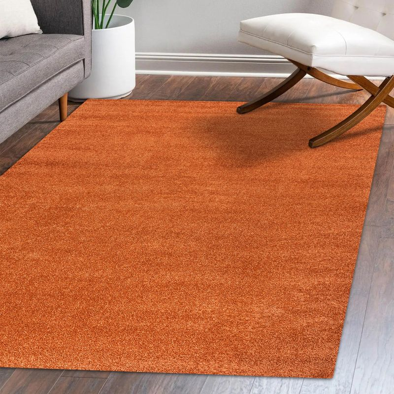 8'x10' Haze Solid Low-Pile Area Rug, Orange - JONATHAN Y