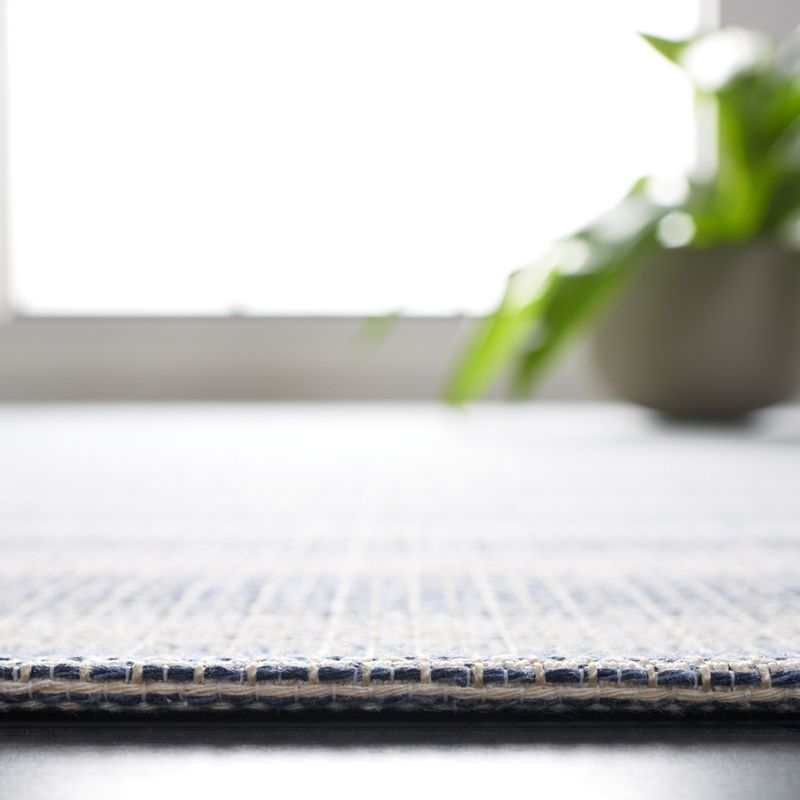Augustine AGT501 Machine Made Indoor Area Rug - Ivory/Navy - 5'x7'-7" - Safavieh