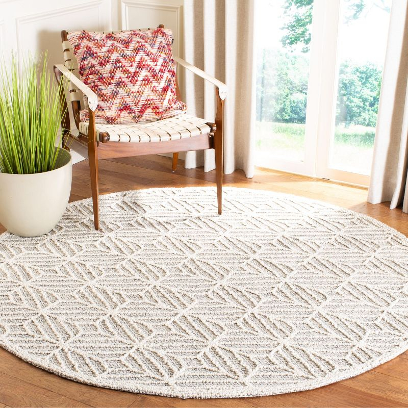 Trace TRC212 Hand Tufted Area Rug - Ivory/Black - 6' Round - Safavieh.