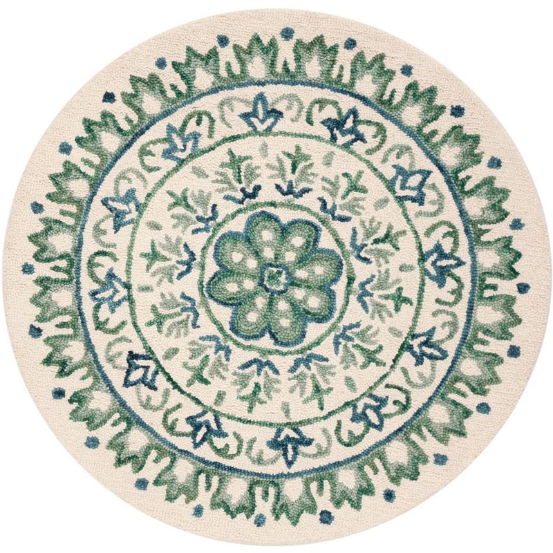 Novelty NOV607 Hand Tufted Area Rug - Ivory/Teal - 4' round - Safavieh.
