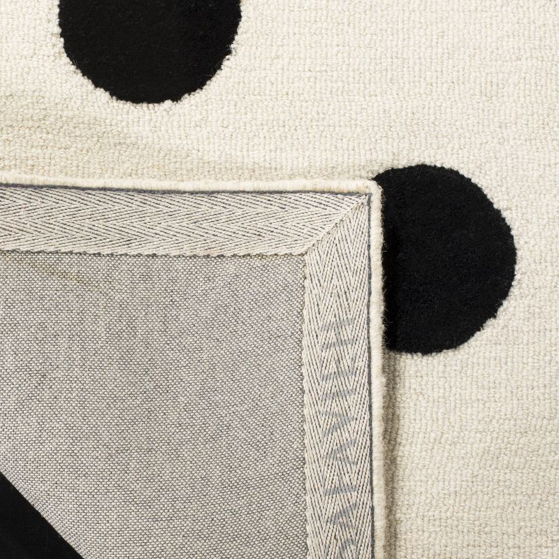 Safavieh Kids Polka Dots SFK904 Hand Tufted Indoor Area Rug - Ivory/Black - 6'x9' - Safavieh