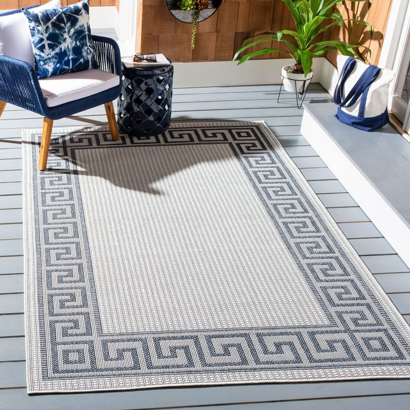 Bermuda BMU820 Power Loomed Indoor/Outdoor Area Rug - Ivory/Blue - 6'7"x9'2" - Safavieh.