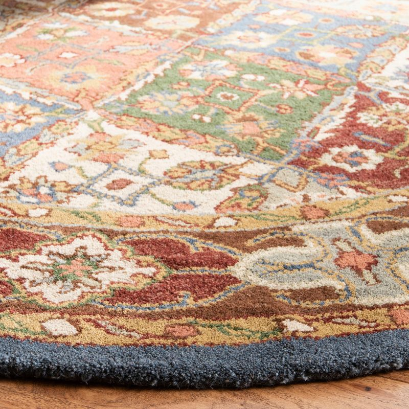 Heritage HG316 Handmade Area Rug - 4'6"x6'6" Oval - Green/Red - Safavieh