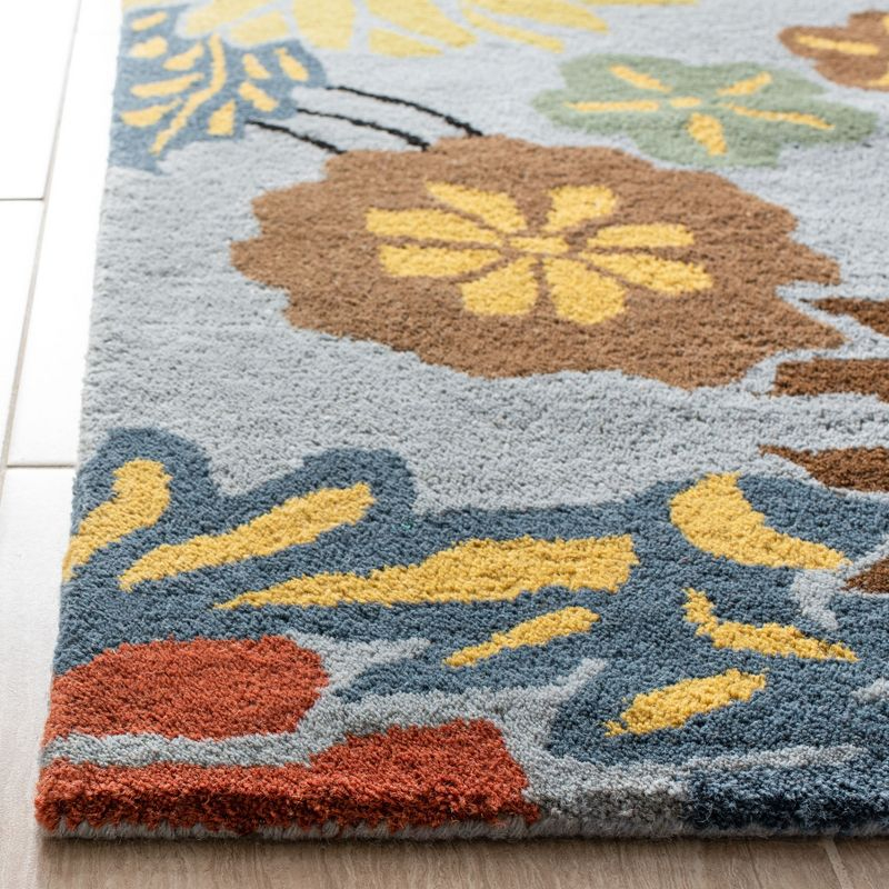Soho SOH738 Hand Tufted Area Rug - Blue/Multi - 8'3"x11' - Safavieh.