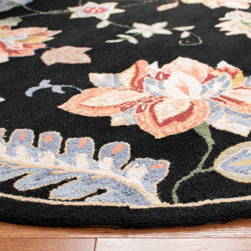 Chelsea HK306 Handmade Area Rug - 4'6"x6'6" Oval - Black - Safavieh