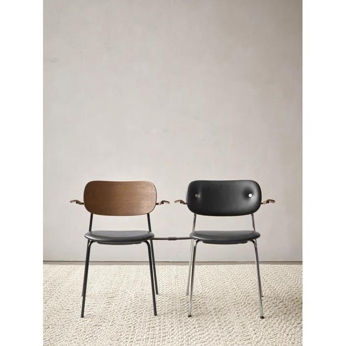 Cozy Minimalist Black Leather and Chrome Dining Chair with Armrests