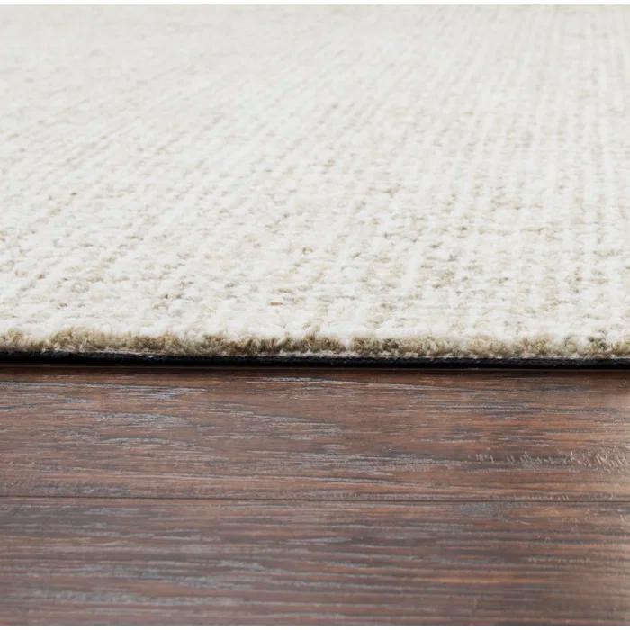 Britley Handmade Tufted Wool Beige Area Rug
