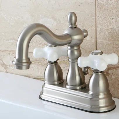 Kingston Brass Heritage Two-Handle 3-Hole Deck Mount 4" Centerset Bathroom Faucet with Plastic Pop-Up