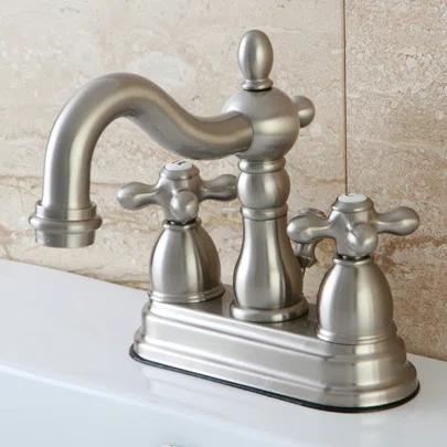 Kingston Brass Heritage Two-Handle 3-Hole Deck Mount 4" Centerset Bathroom Faucet with Plastic Pop-Up