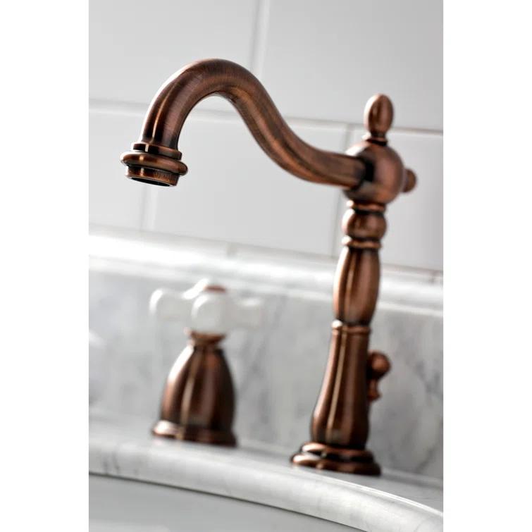 Kingston Brass Heritage Two-Handle 3-Hole Deck Mount Widespread Bathroom Faucet with Brass Pop-Up Drain